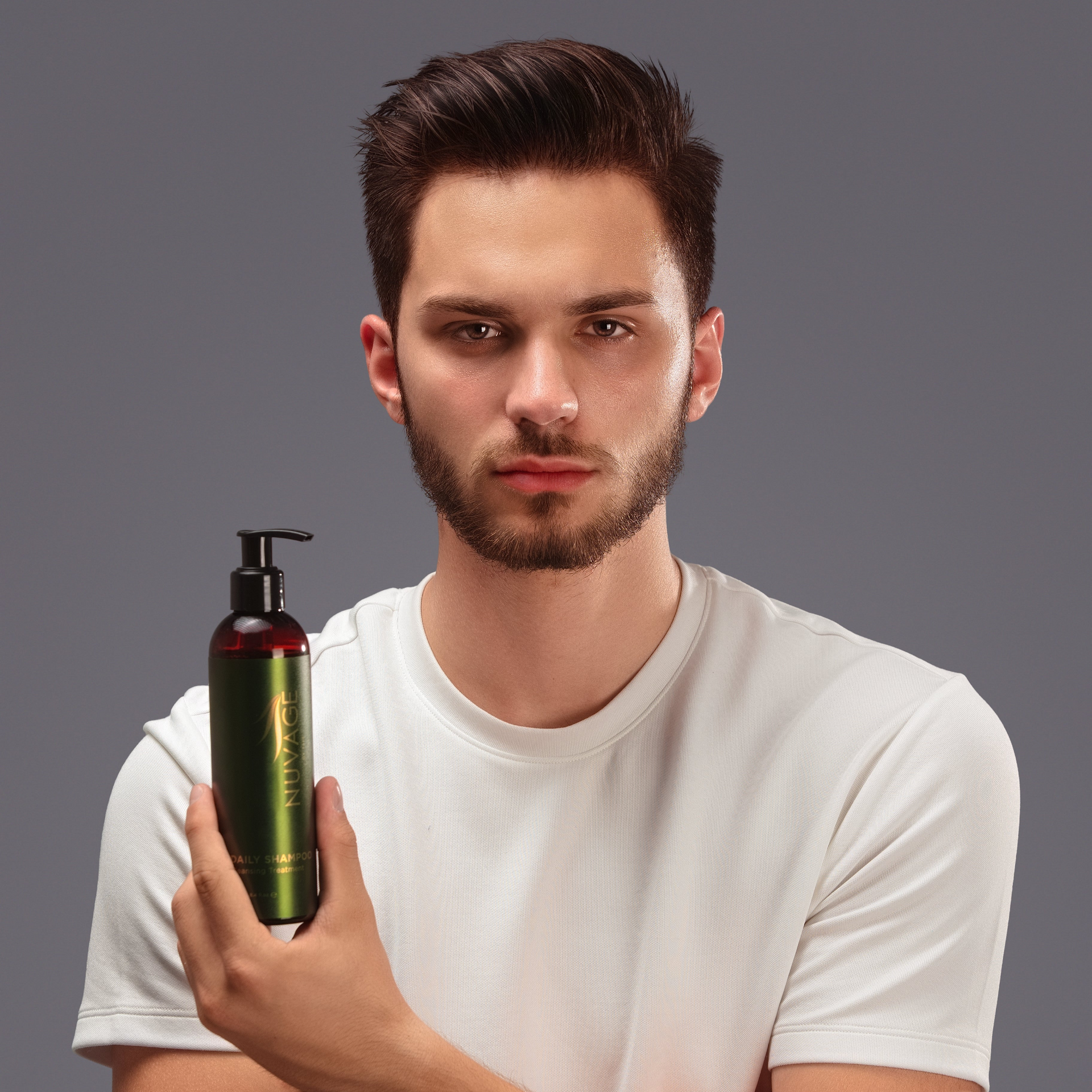 Daily Shampoo - Body&Hair held by a model showcasing its versatile use for hair and skin.