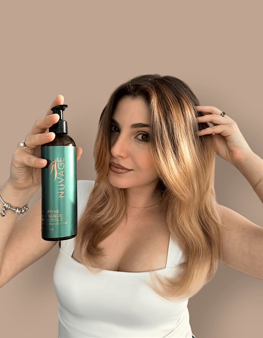 Nuvage Sculpting Hair Glaze 250ml in a woman's hand, showcasing shiny, smooth hair with a natural look.